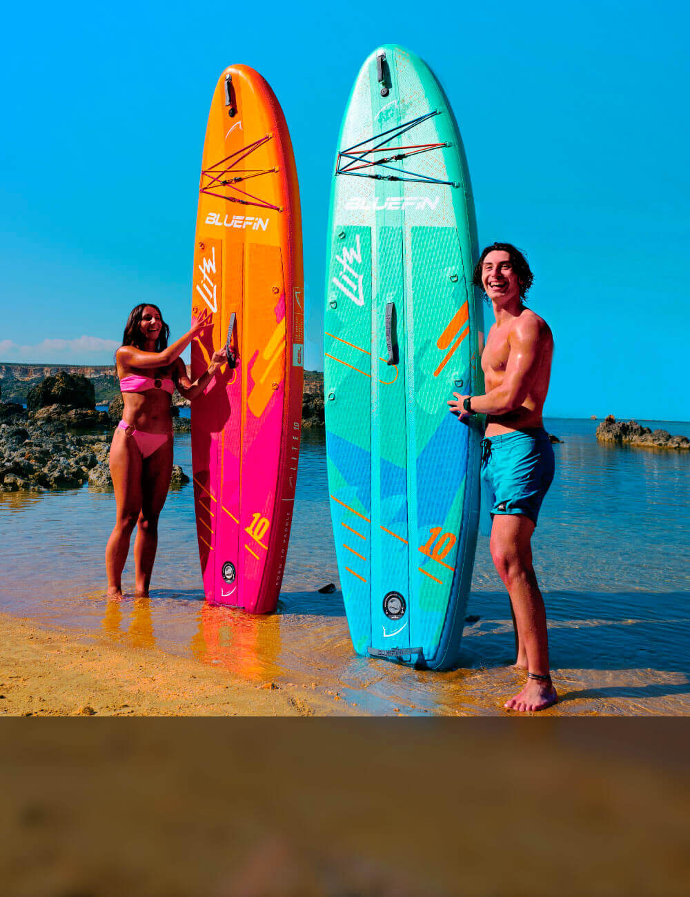Two people on a beach with Bluefin Lite travel sup