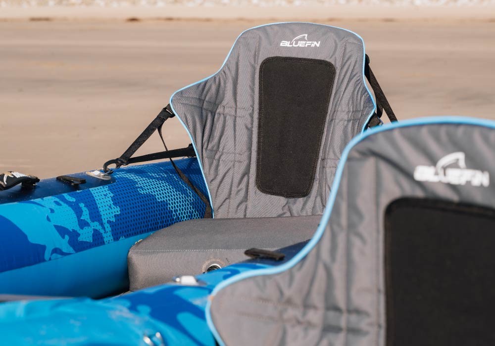 Close-up of a Bluefin SUP seat with comfortable cushioning and adjustable straps.
