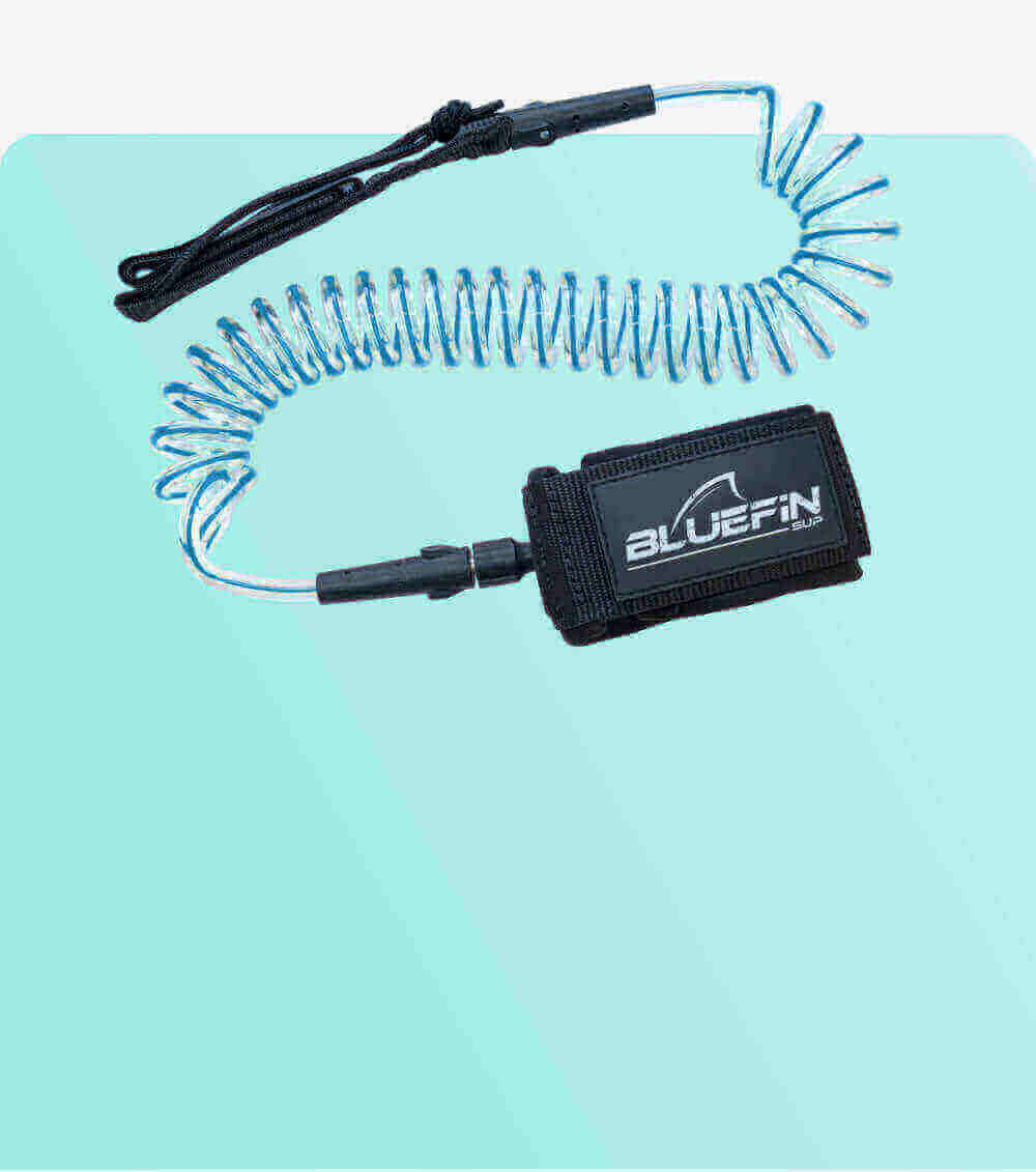 Coiled safety leash with black strap and blue cord, designed for paddleboarding.