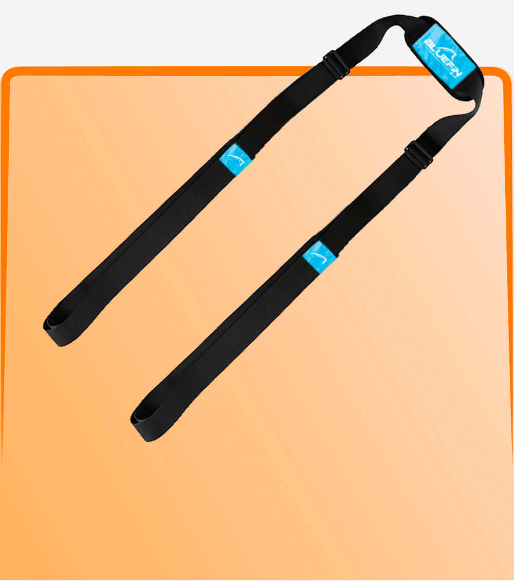 Black inflatable paddle board carry strap on a peach background