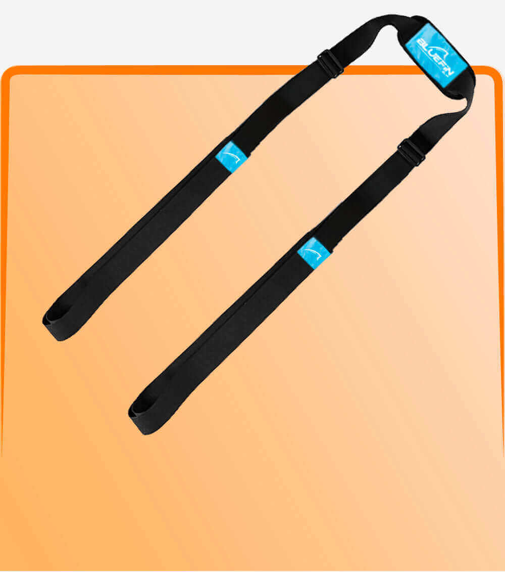 Black inflatable paddle board carry strap on a peach background