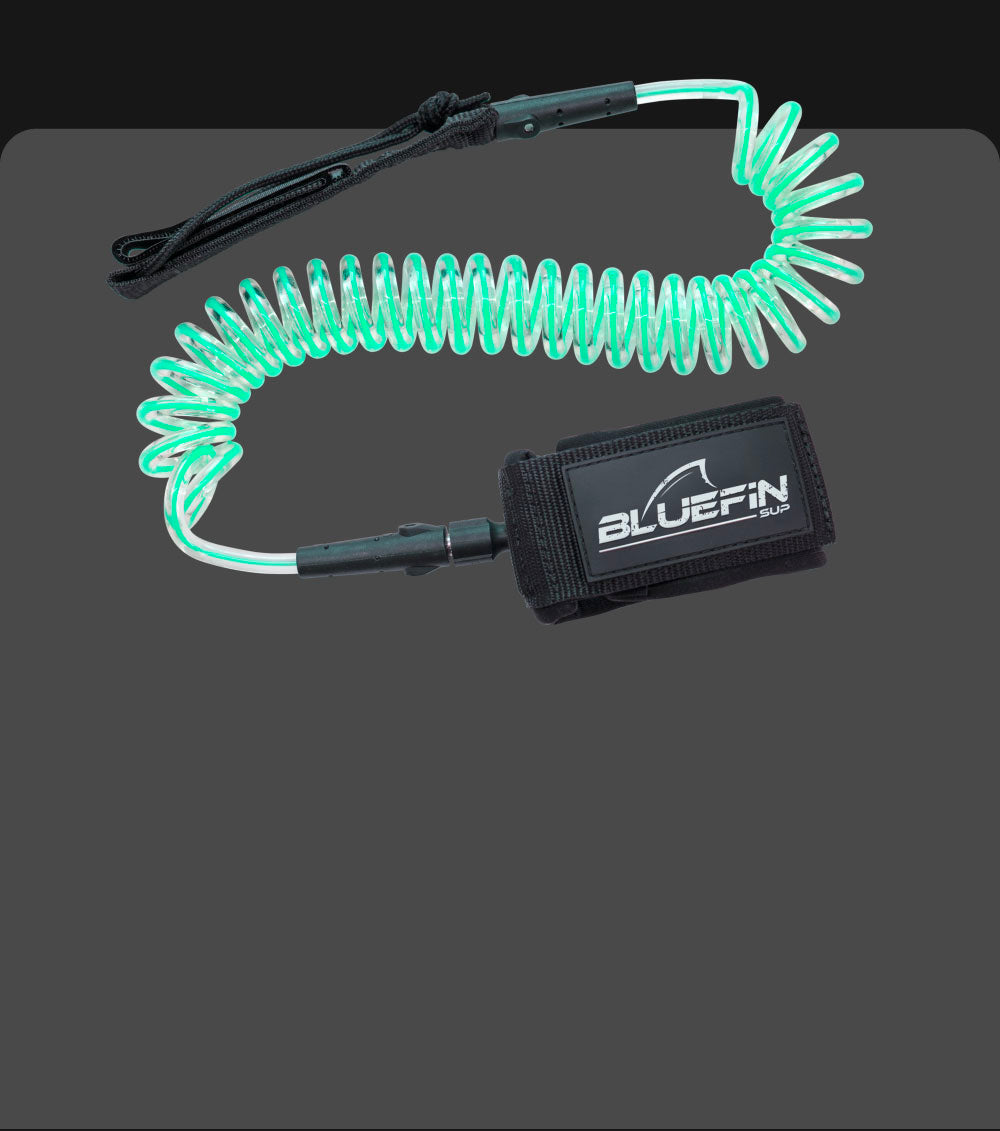 Bluefin SUP coiled safety leash in glowing green, featuring a sturdy Velcro ankle strap.
