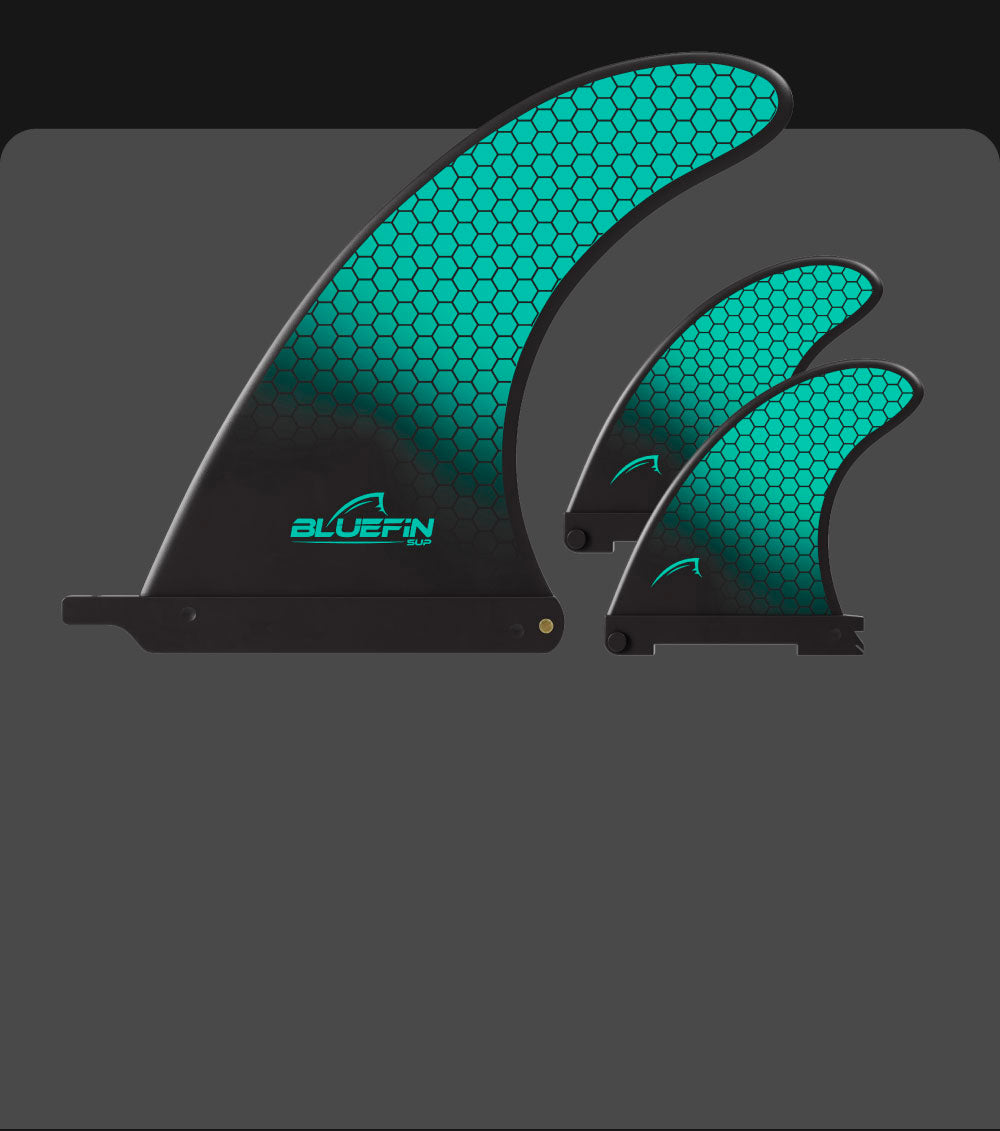 Bluefin SUP fins in black with turquoise hexagonal design, showcasing three sizes.