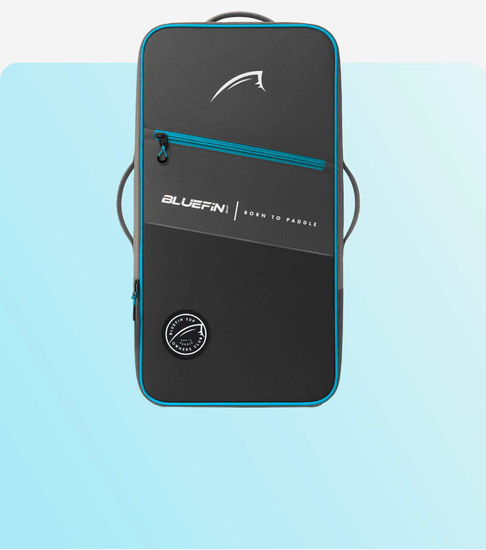 Bluefin SUP backpack with black exterior, blue accents, and "Born to Paddle" logo.