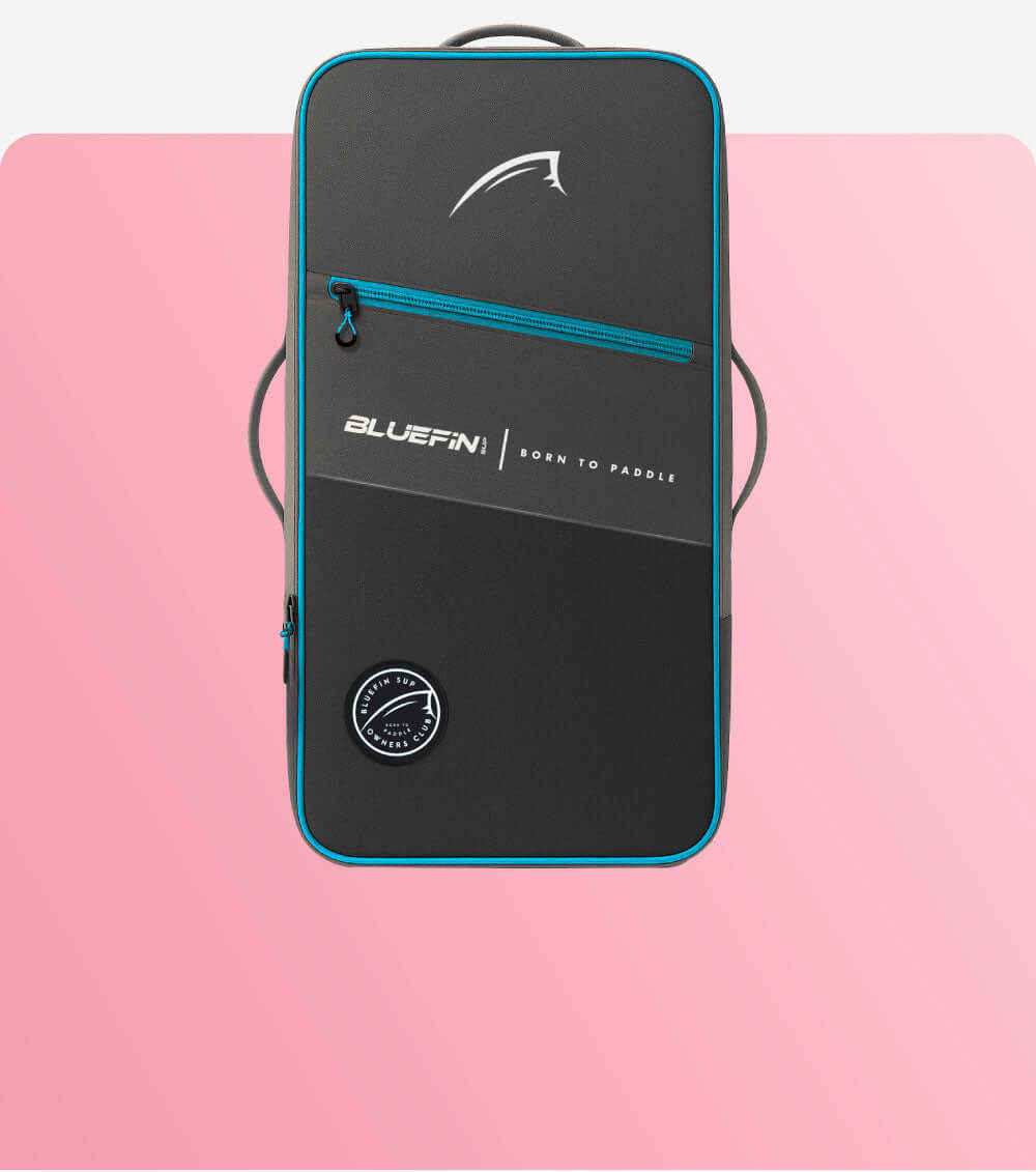 Bluefin SUP bag featuring a sleek design with logo and bright blue accents on a pink background.