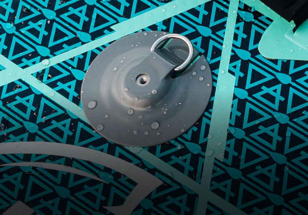 Close-up of a paddleboard attachment with water droplets on a patterned surface.
