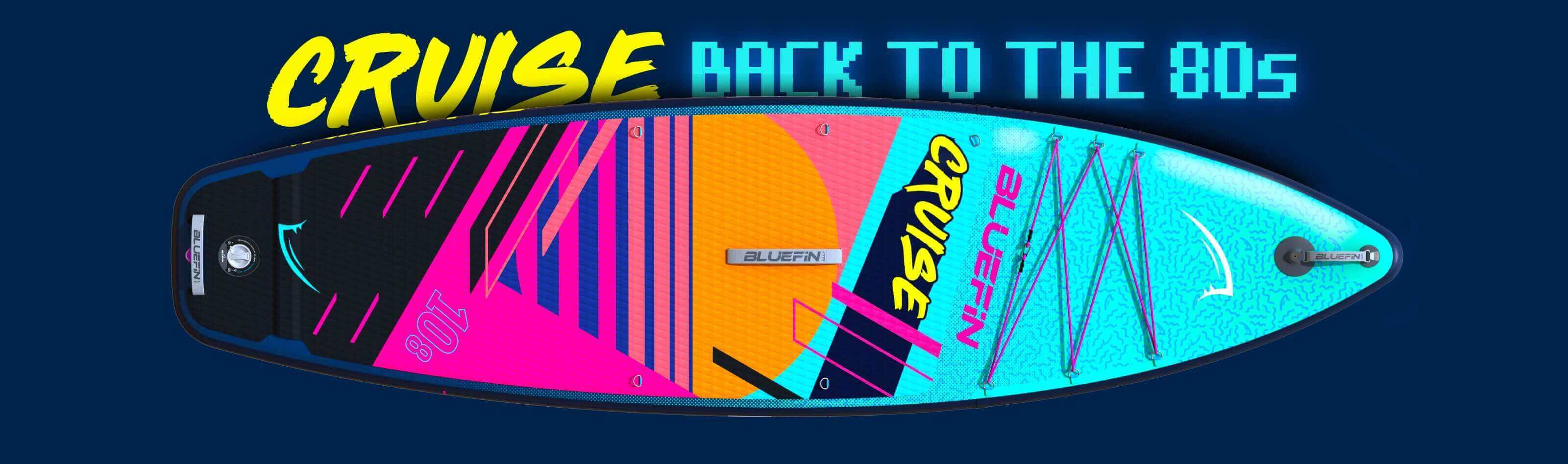 Colorful Bluefin SUP board with retro 80s design, featuring vibrant patterns and "Cruise" branding.