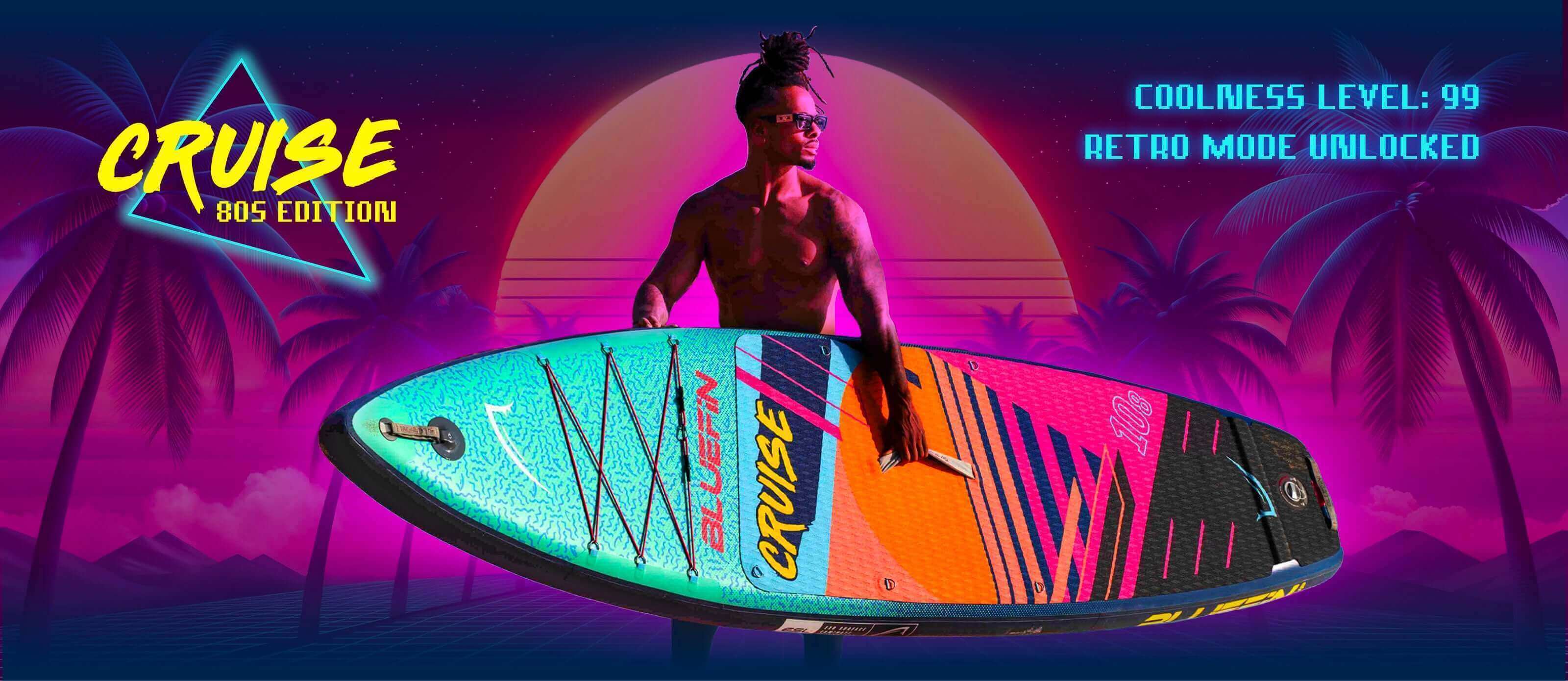 A man stands with a vibrant Bluefin SUP board, surrounded by a retro beach backdrop with palm trees.