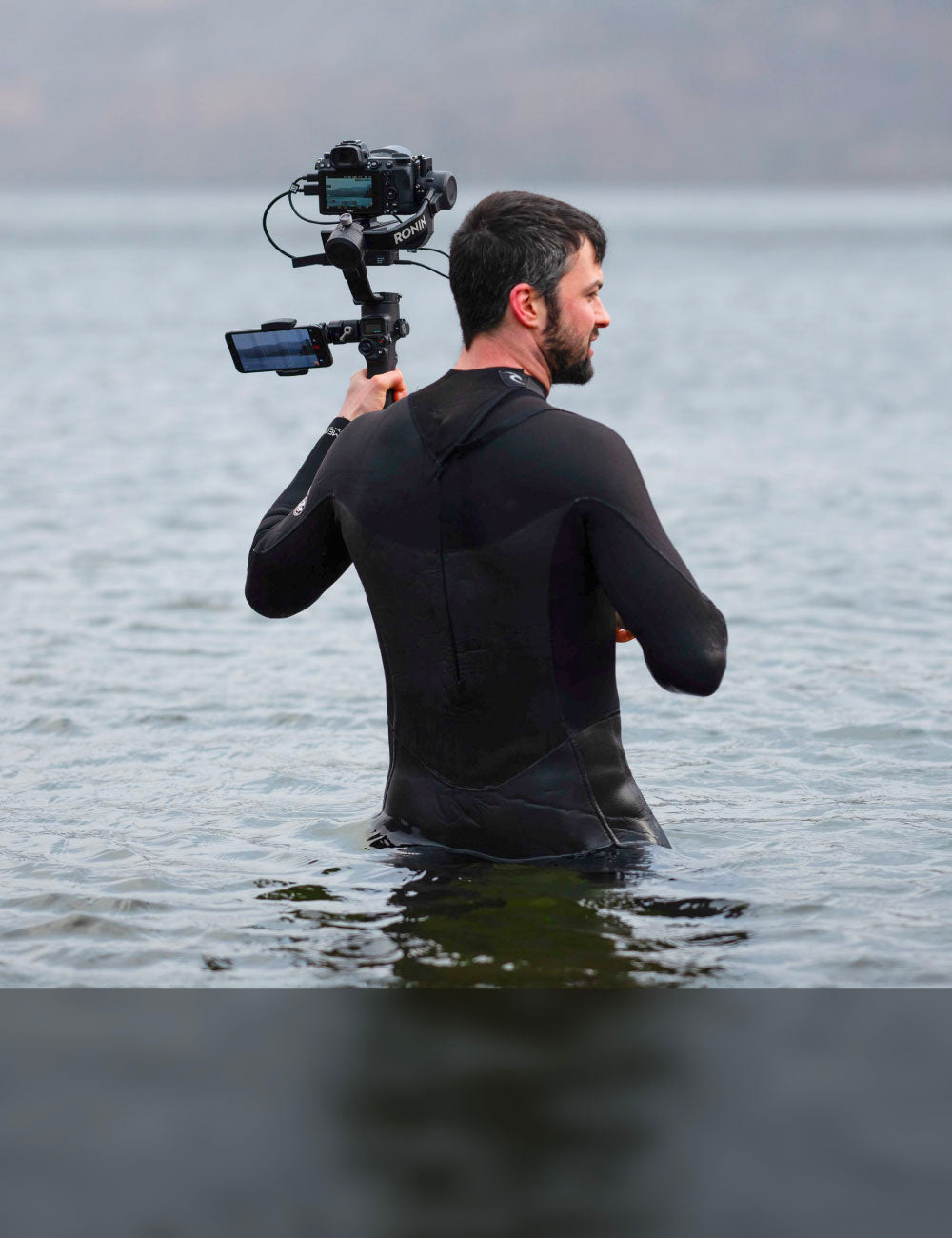 Someone holding a camera in the water whilst getting videos of the bluefin inflatable paddle board sup