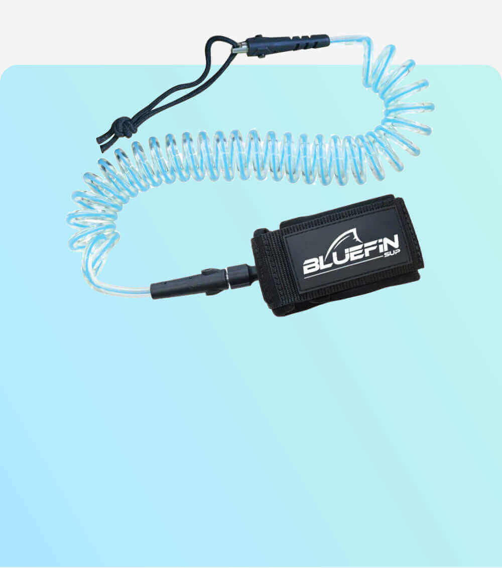 Coiled leash for stand-up paddleboarding, featuring a padded ankle strap with Bluefin SUP logo.