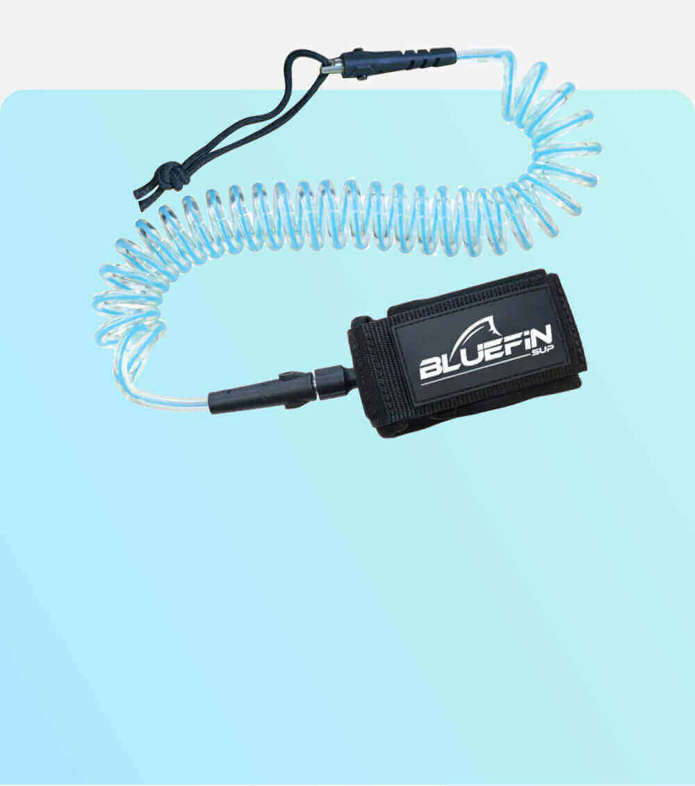 Coiled leash for stand-up paddleboarding, featuring a padded ankle strap with Bluefin SUP logo.