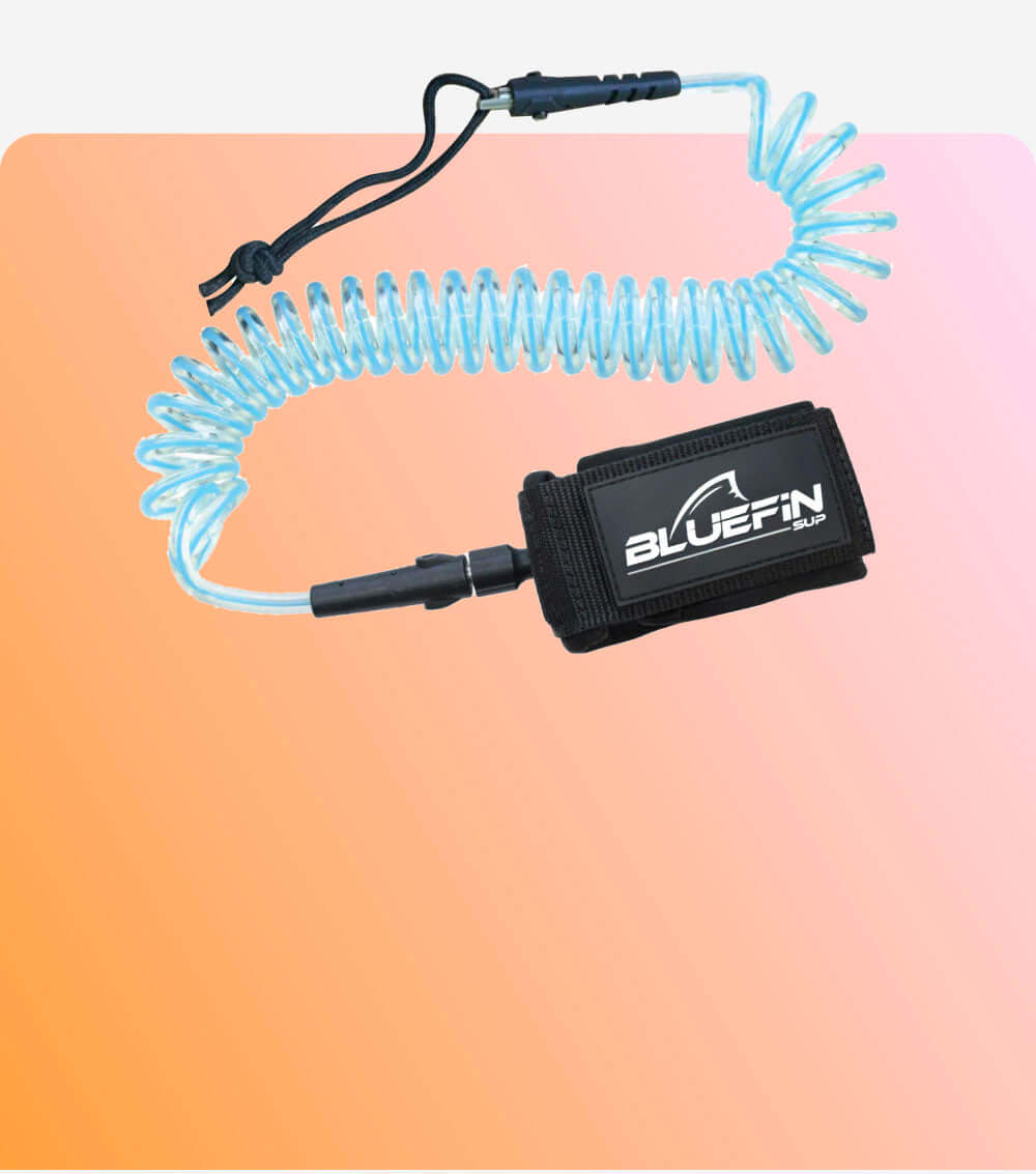 Bluefin SUP safety leash with a coiled design, featuring a Velcro ankle strap. Ideal for paddleboarding.