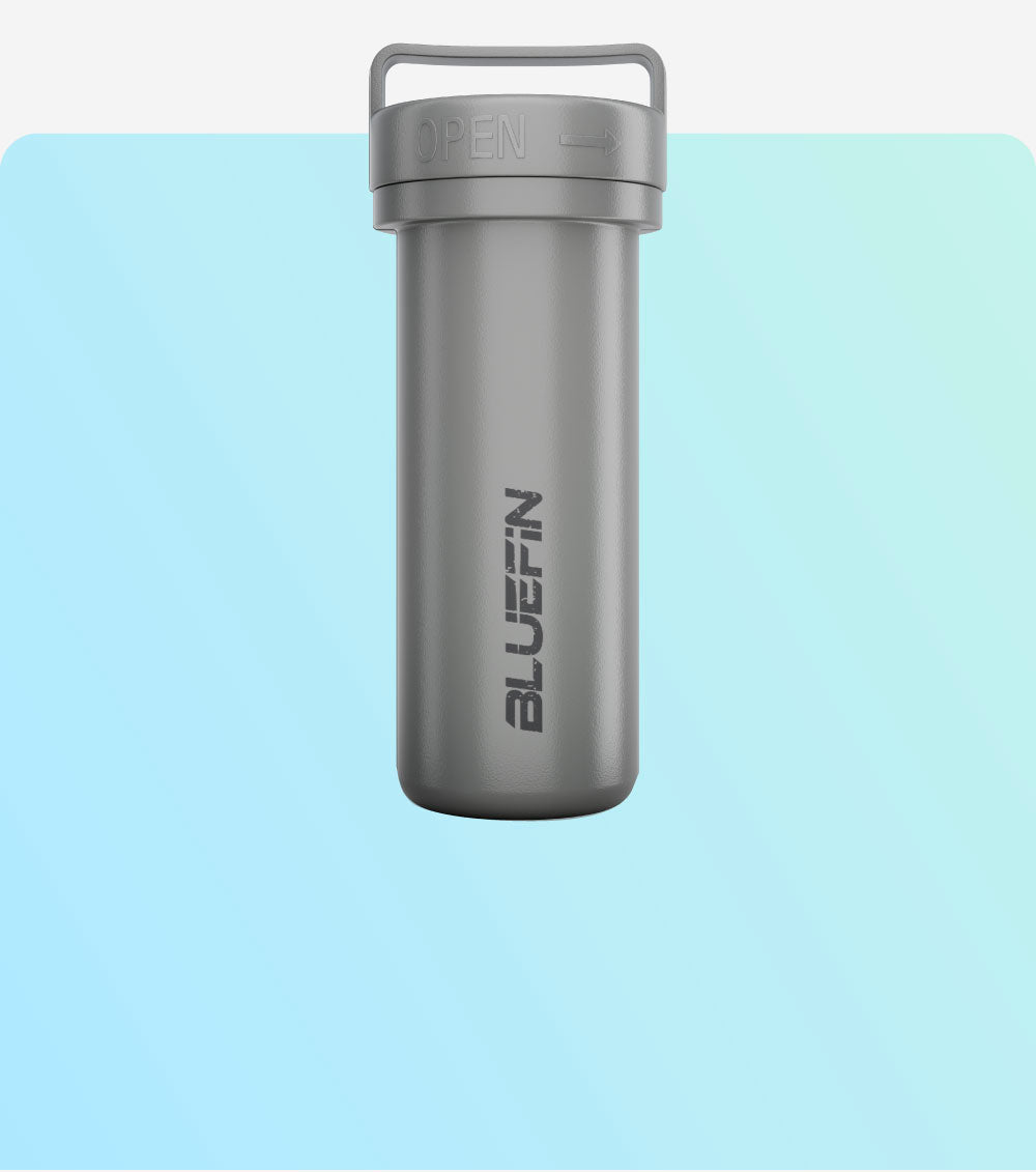 Gray waterproof container with "BLUEFIN" logo, shown against a soft blue background. Ideal for outdoor use.