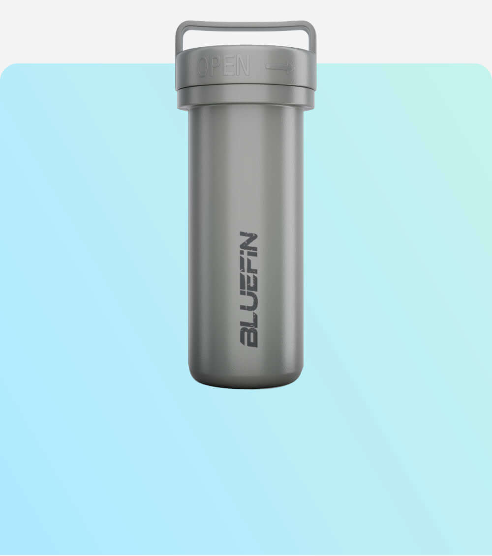 Gray waterproof container with "BLUEFIN" logo, shown against a soft blue background. Ideal for outdoor use.
