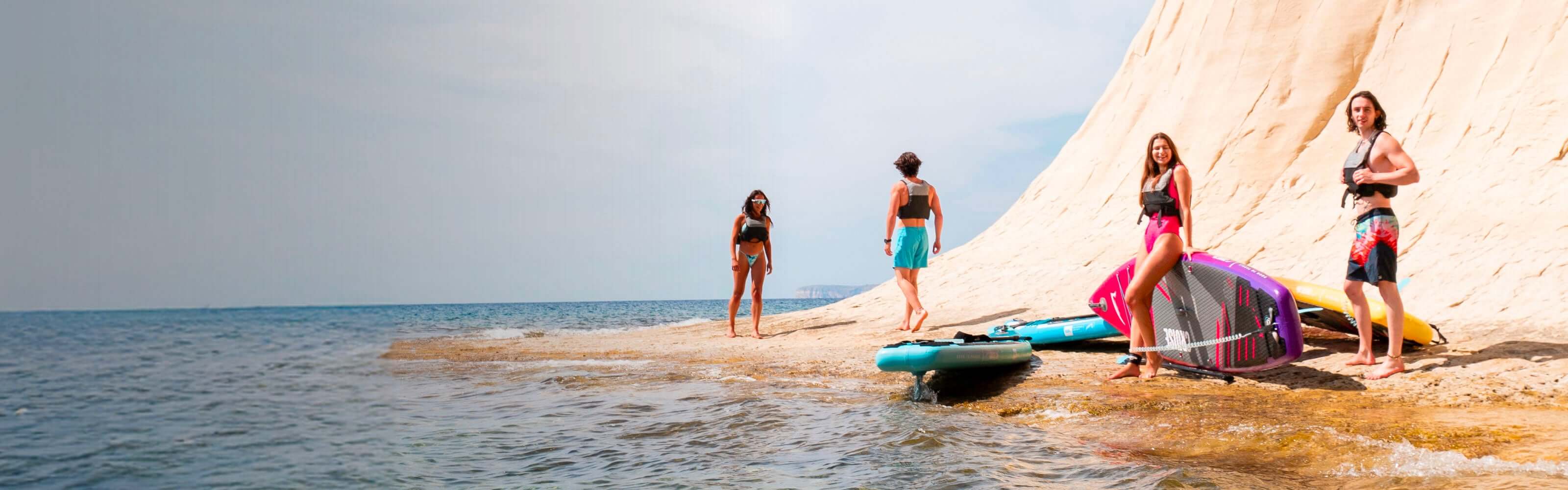 Paddleboarding group with Bluefin Cruise 10'8 stand up paddle board by the sea