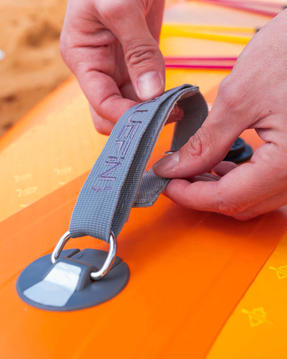 Close up shot of the Bluefin Sup carry straps for the Lite Colourway Pink Coral