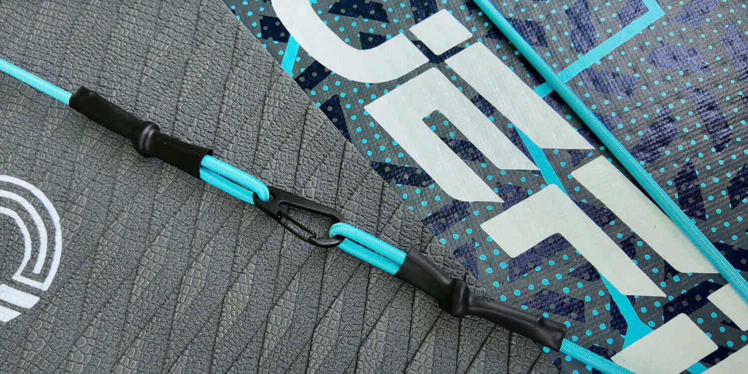 close up of the bungee cord and textured deckpad on the rogue paddleboard