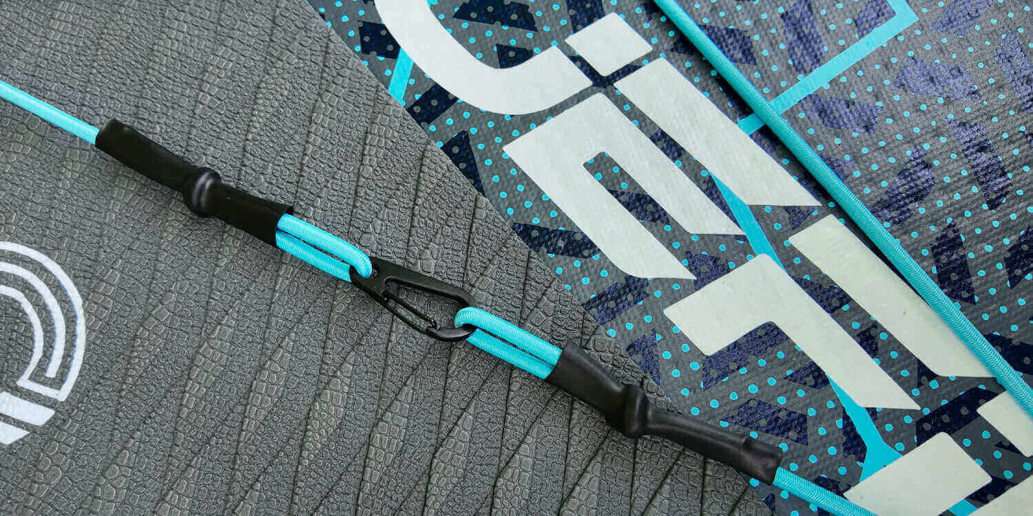close up of the bungee cord and textured deckpad on the rogue paddleboard
