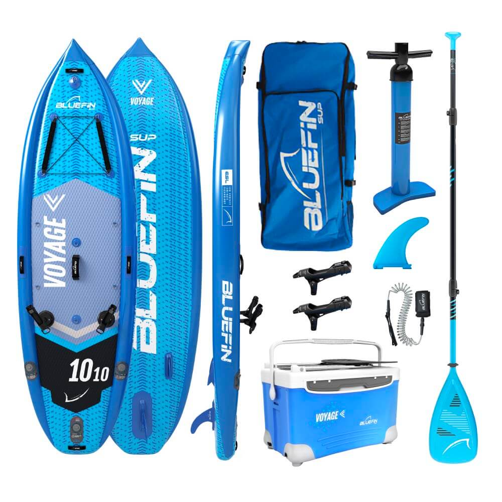 Bluefin SUP Voyage bundle with inflatable paddleboard, pump, paddle, fin, backpack, and cooler.