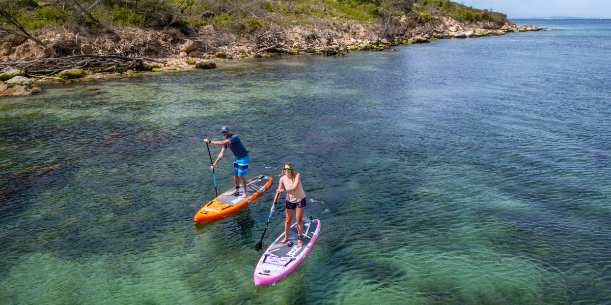 two people paddleboarding