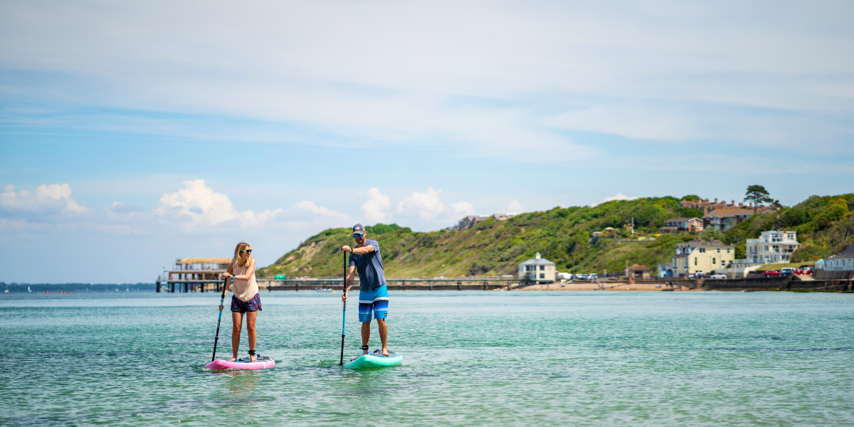 two people on paddle boards