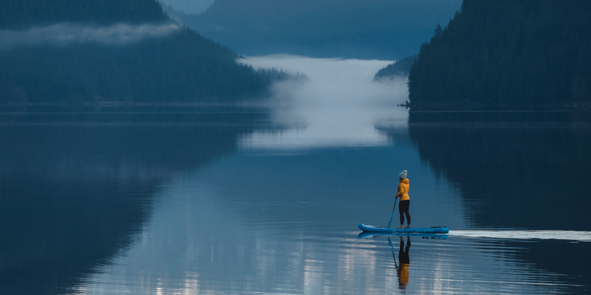 woman paddleboarding in a lake