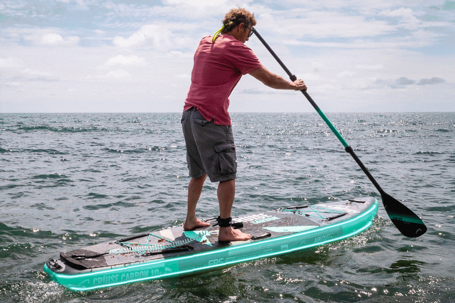 Shot of the Bluefin Carbon stand up paddle board in the ocean highlighting the FRS feature on this sup paddle board