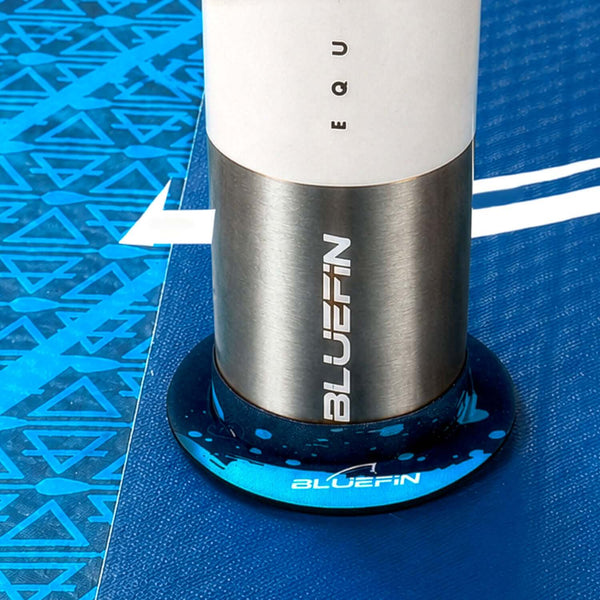 Inflatable paddleboard with a blue textured deck, center fin, and stainless steel valve