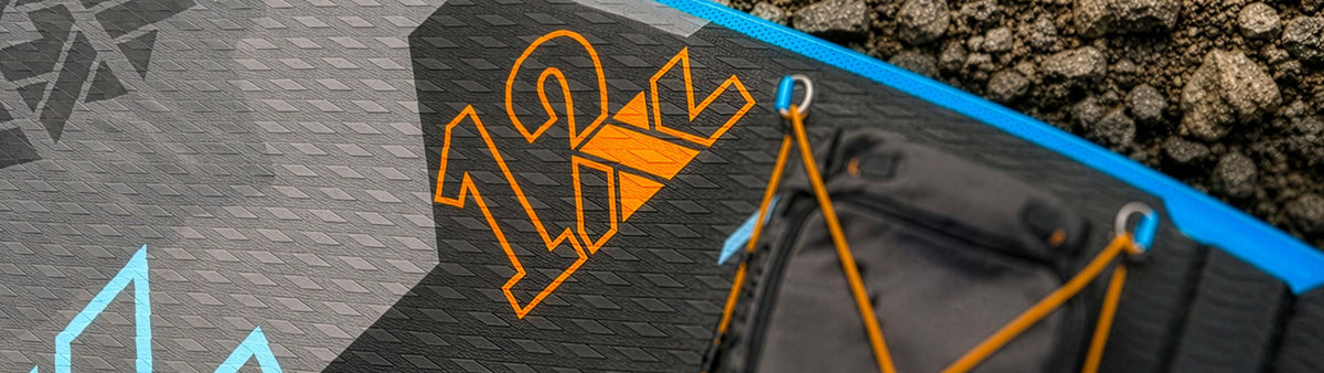 Inflatable paddleboard featuring a textured surface, orange 12' logo, and black storage area