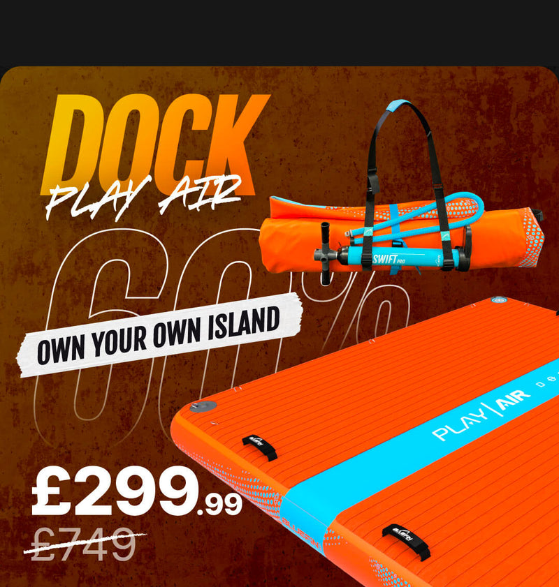 Orange inflatable paddleboard with textured surface and blue accents, carrying strap included