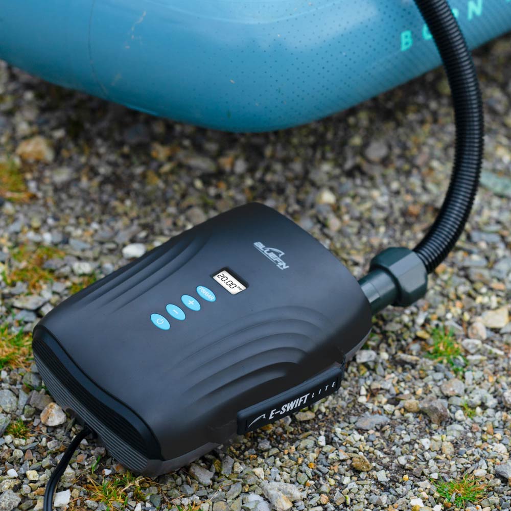 An electric SUP (stand-up paddleboard) pump with multiple nozzles attached, ready to inflate inflatable watercraft effortlessly.