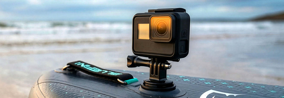 Action camera mounted on a paddleboard, capturing the ocean waves in the background