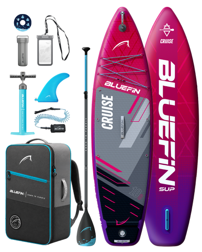 Inflatable paddleboard kit with pink and gray board, paddle, pump, fin, backpack, and accessories.