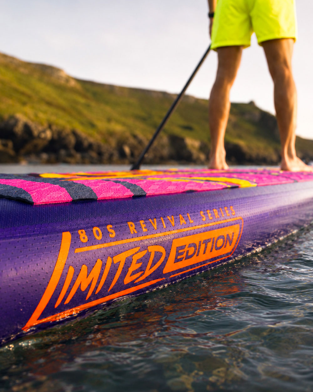 Inflatable paddleboard with purple and pink design, featuring 'Limited Edition' text and textured surface.