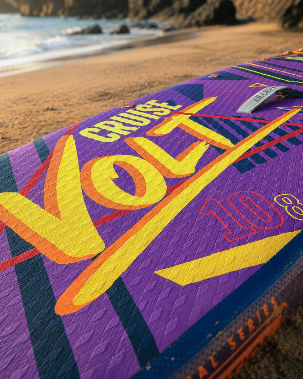 Inflatable paddleboard with vibrant purple design, featuring the text 'Cruise Volt 10.8' on the deck.