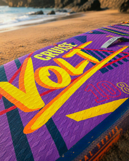 Inflatable paddleboard with vibrant purple design, featuring the text 'Cruise Volt 10.8' on the deck.